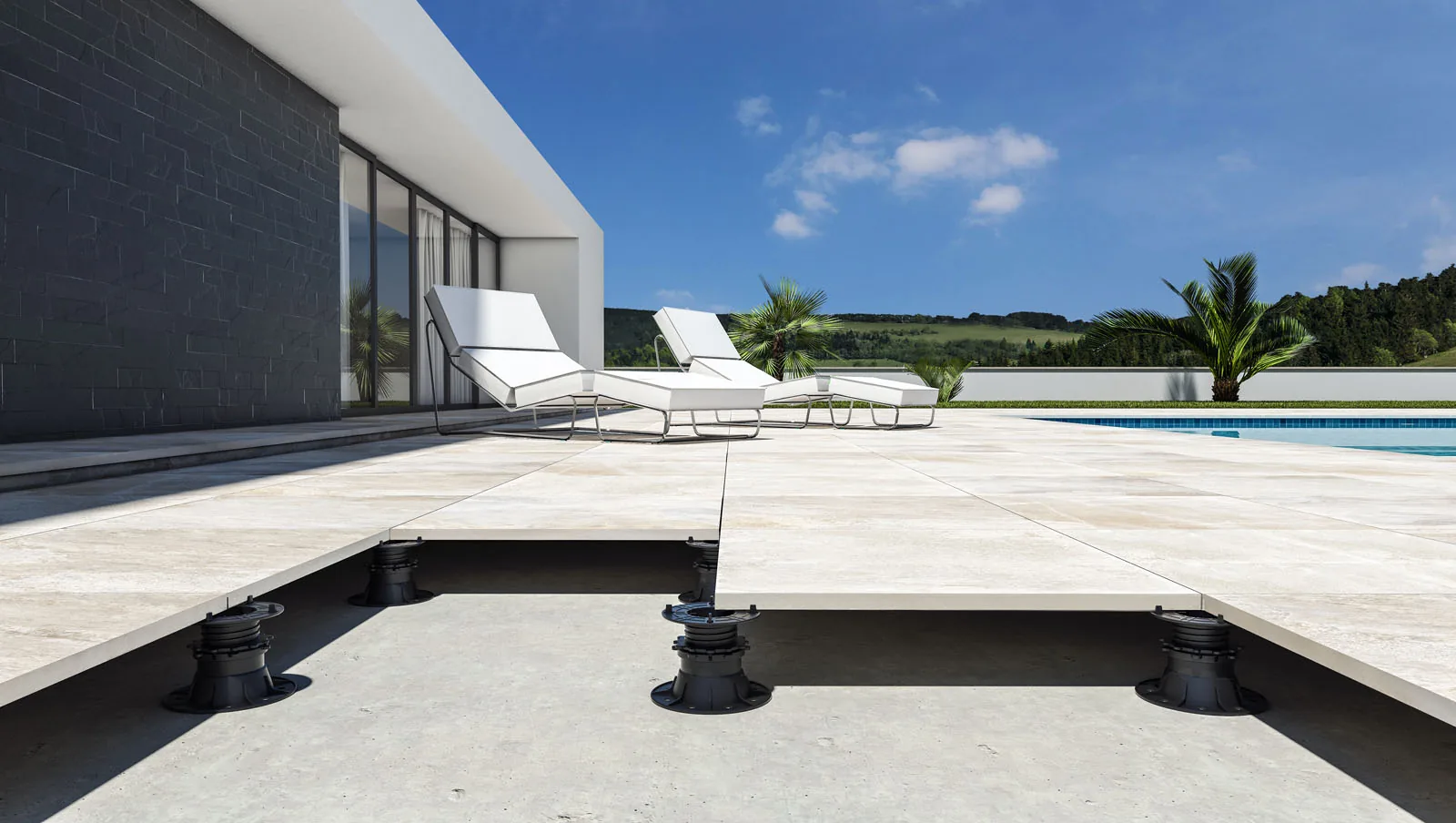 Terraza de piscina en porcelánico de 20 mm color hueso sobre plots elevados