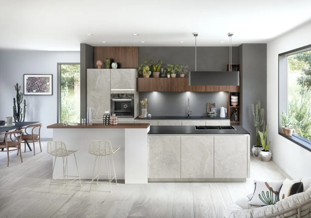 Cocina con isla de frente efecto piedra clara y encimera de madera